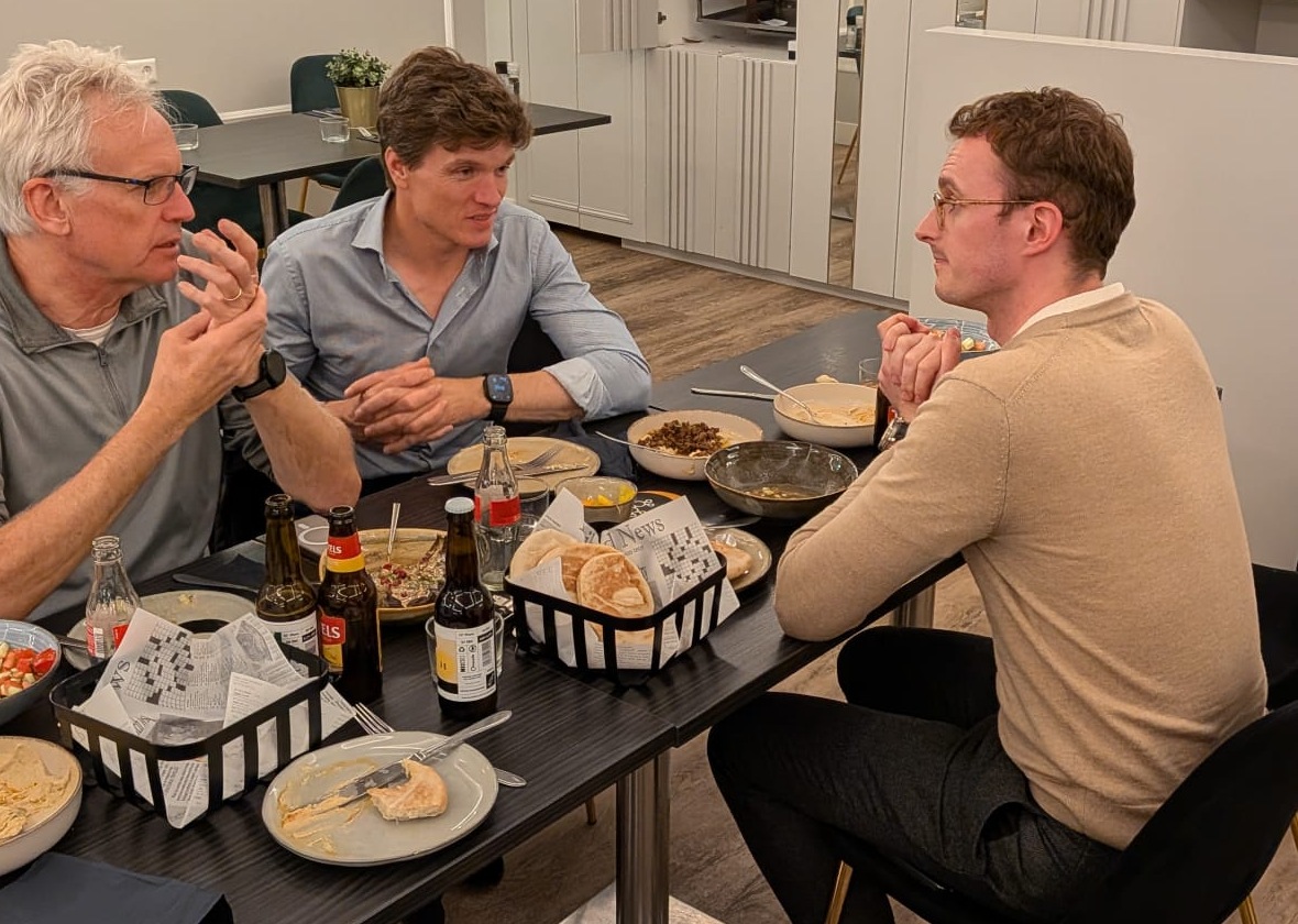 Three founders in conversation over dinner at an FTW Investment Climate Dinner